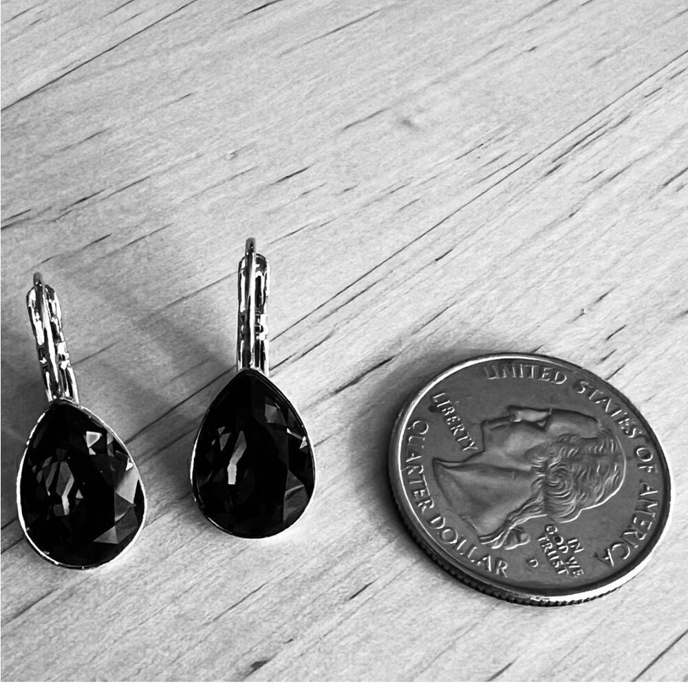 Handcrafted earrings with a sparkly reddish pinkish teardrop Swarovski crystal