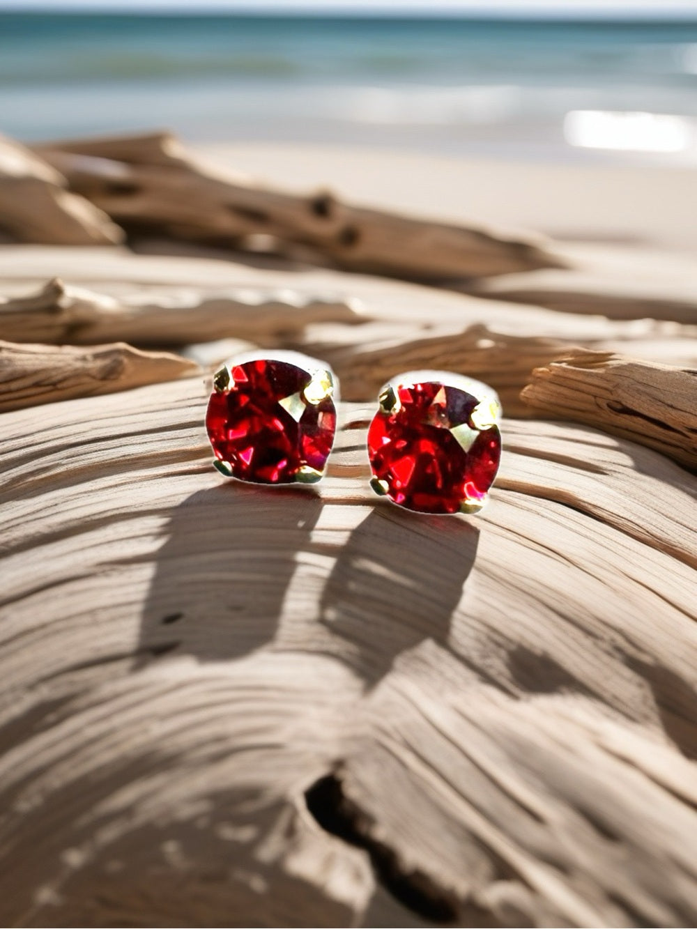 Handcrafted earrings with a light siam red Swarovski crystal