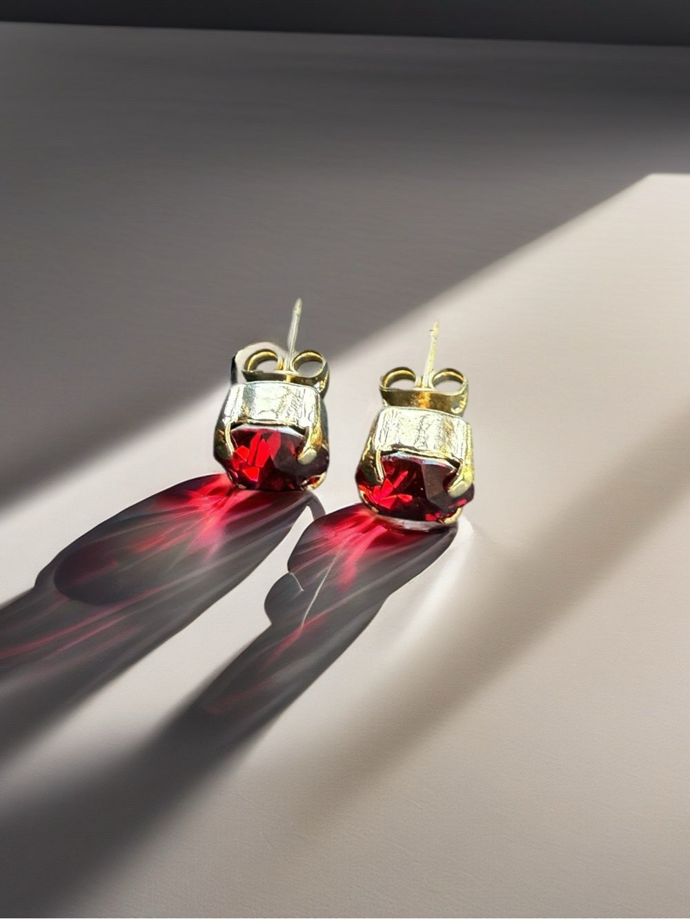 Handcrafted earrings with a light siam red Swarovski crystal