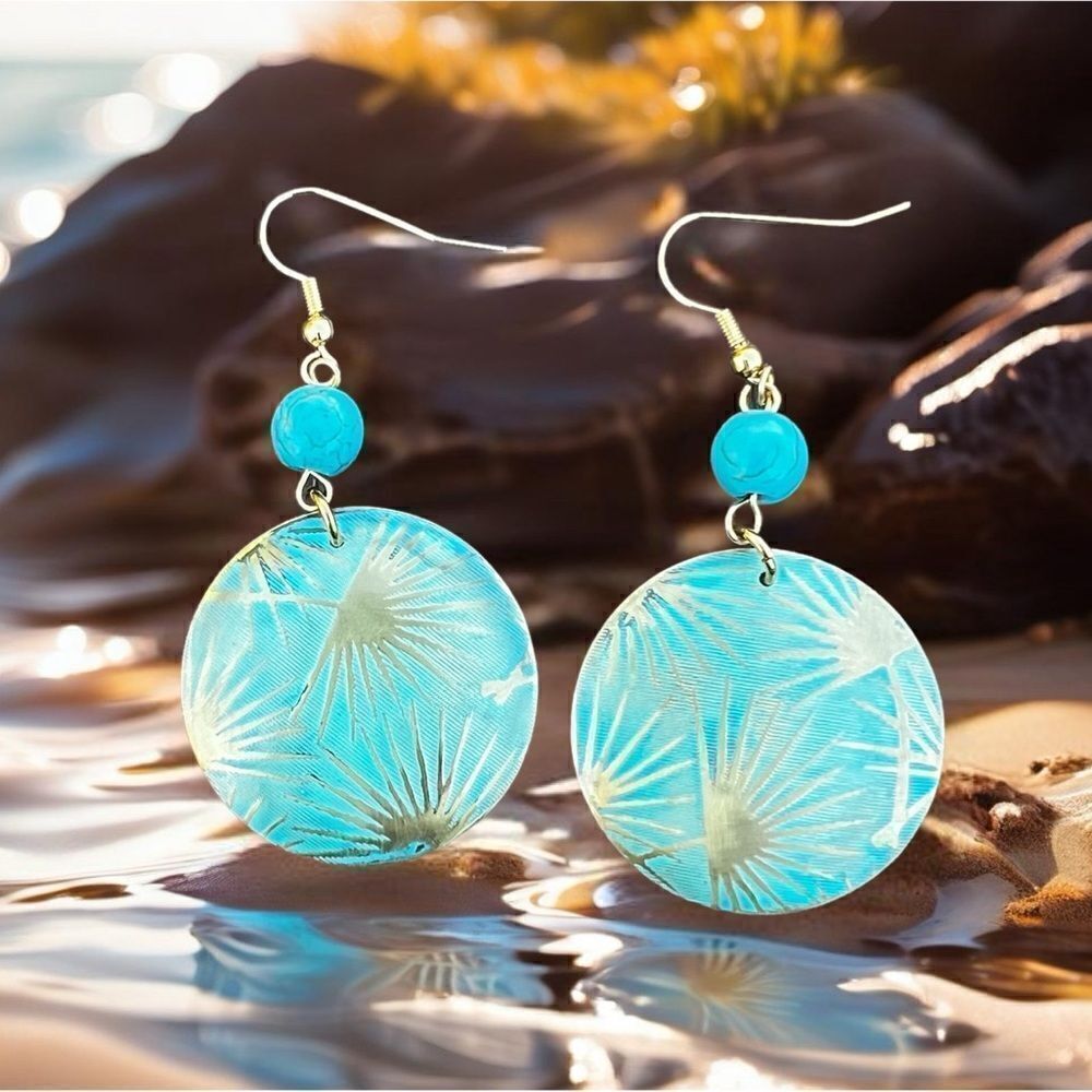 Patina metal earrings with a turquoise shade and gold on earwire