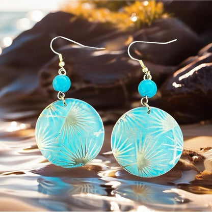 Patina metal earrings with a turquoise shade and gold on earwire