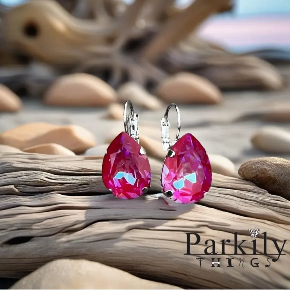Earrings with reddish/pinkish Swarovski crystal