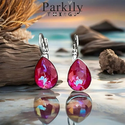 Handcrafted earrings with a sparkly reddish pinkish teardrop Swarovski crystal
