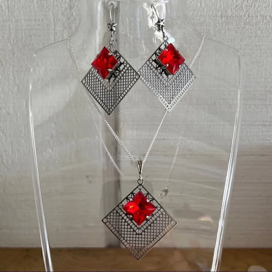 Necklace and earring set with red Swarovski crystals with silver design
