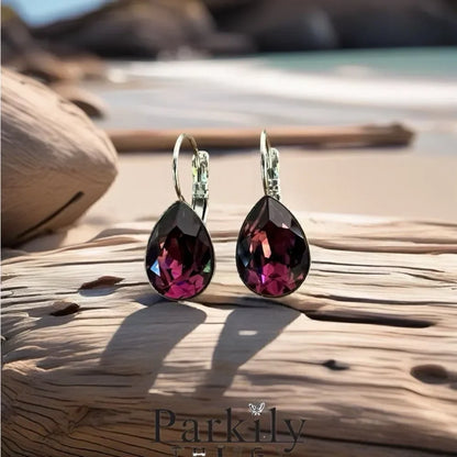 Handcrafted earrings with a purple amethyst teardrop Swarovski crystal